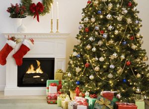 Decorated Christmas Tree by a Fireplace with a stocking