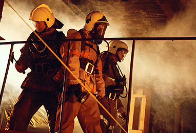 Three fireman in full fire gear